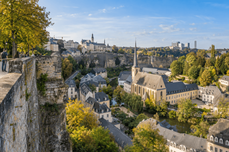 Photorealistic view from Luxembourg City’s Corniche over the fortress walls, Grund and the Alzette valley