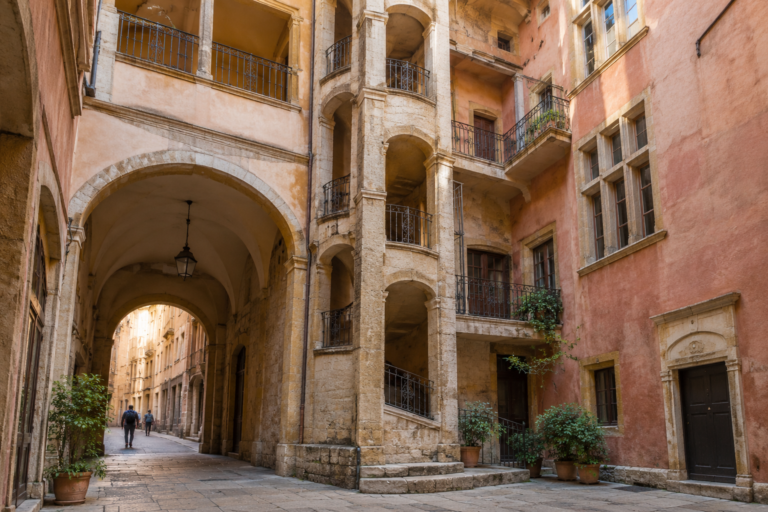 Renaissance traboule courtyard with arched passage and galleries in Vieux Lyon