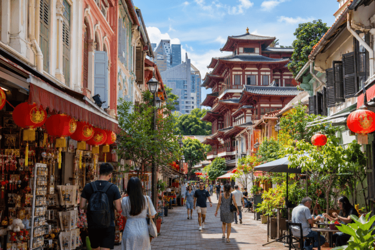 Photorealistic Singapore Chinatown street with colourful shophouses, red lanterns and the Buddha Tooth Relic Temple