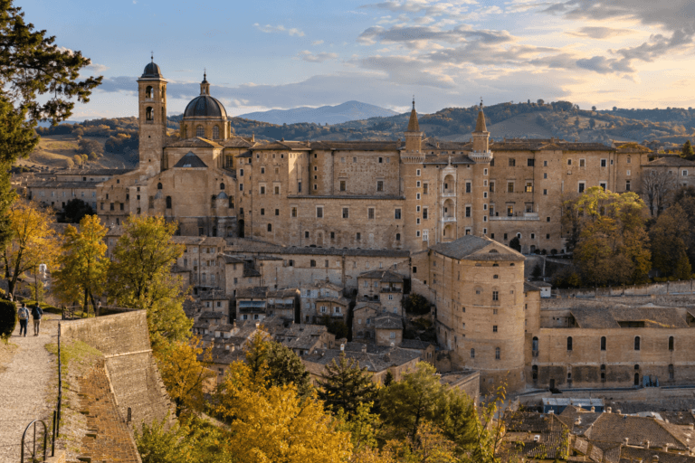 Photorealistic view of Palazzo Ducale and Urbino’s terracotta roofs across the Marche hills